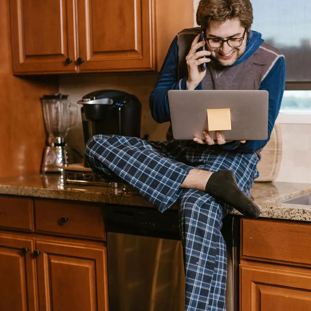 young man on laptop working from home