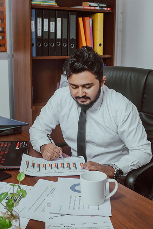 business owner looking at balance sheet