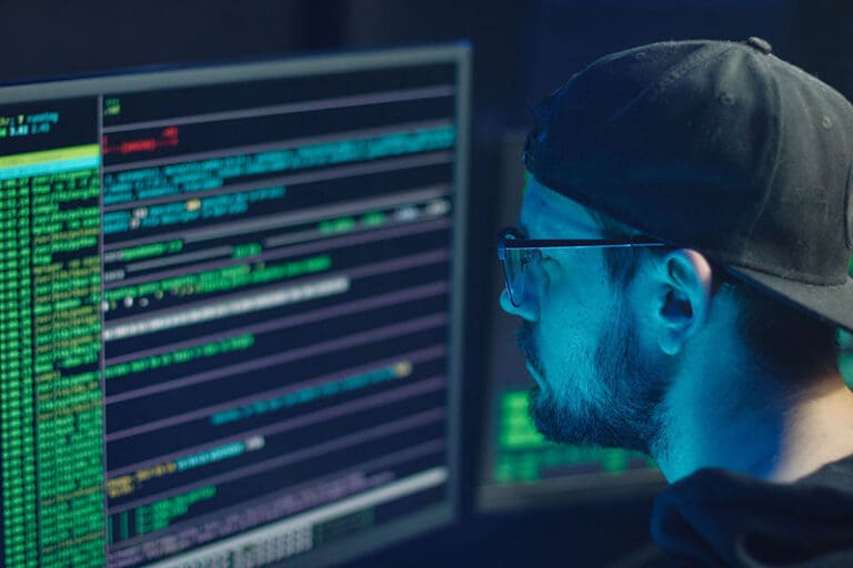 A developer reviewing code on a monitor
